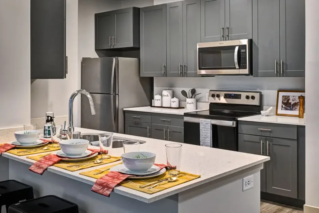 Spacious apartment kitchen at 320 West Mag apartments in Auburn, Alabama.