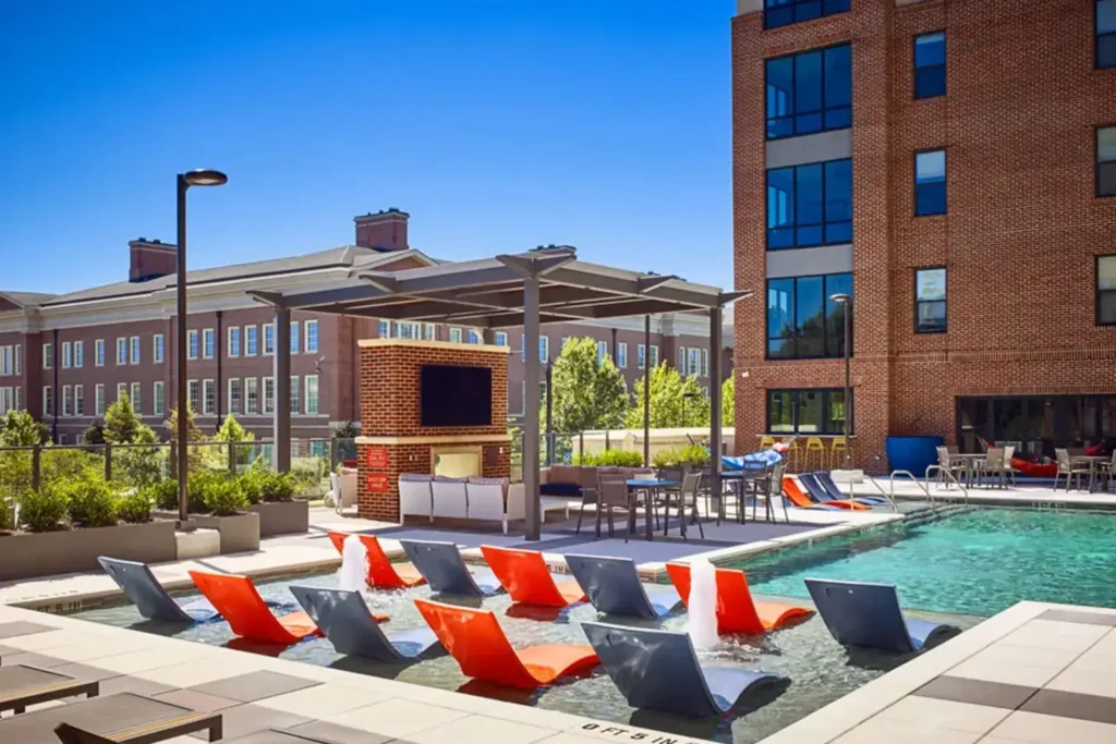 Student housing pool and relaxation area at 320 West Mag apartments in Auburn, AL.