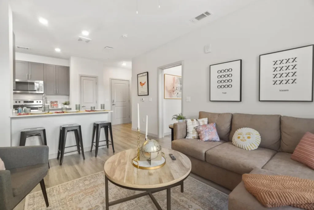 Bright living space inside 320 West Mag, student apartments close to Auburn University